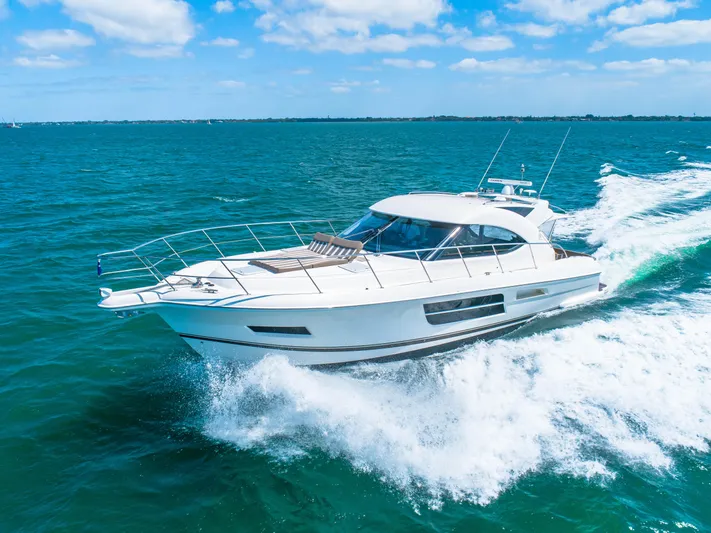 Belle-rosa Yacht Photos Pics 2016 Riviera 5000 Sport Yacht cruising on open sea.