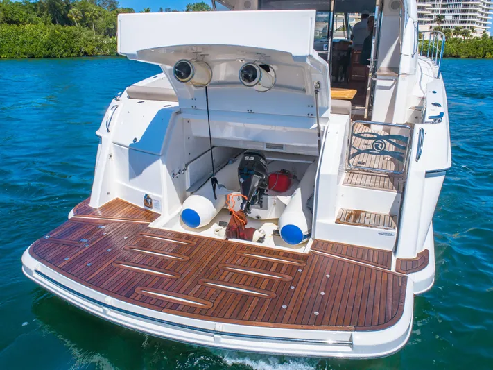 Belle-rosa Yacht Photos Pics 2016 Riviera 5000 Sport Yacht with open storage on water.