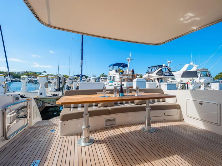 Belle-rosa Yacht Photos Pics 2016 Riviera 5000 Sport Yacht with spacious deck and marina view.