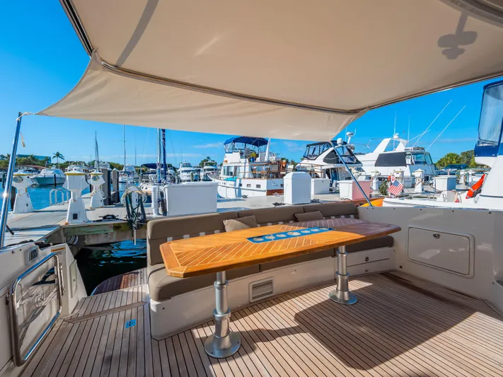 Belle-rosa Yacht Photos Pics 2016 Riviera 5000 Sport Yacht with stylish deck and marina view.