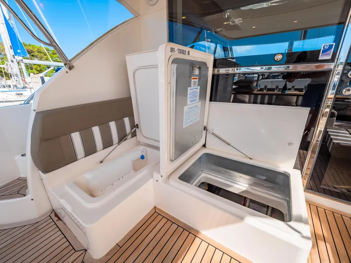 Belle-rosa Yacht Photos Pics 2016 Riviera 5000 Sport Yacht with open cooler on deck.