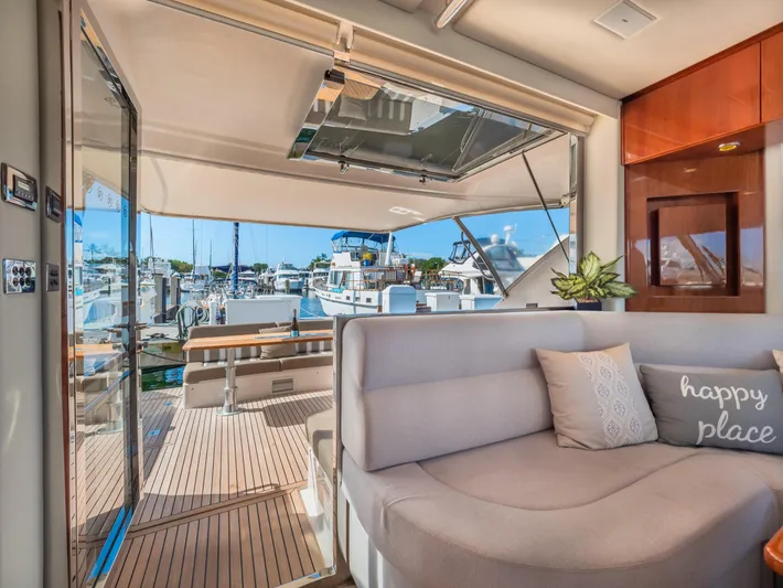 Belle-rosa Yacht Photos Pics Interior of 2016 Riviera 5000 Sport Yacht with cozy seating area.
