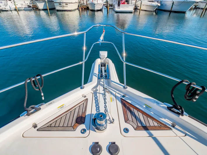 Belle-rosa Yacht Photos Pics Bow view of 2016 Riviera 5000 Sport Yacht in marina.