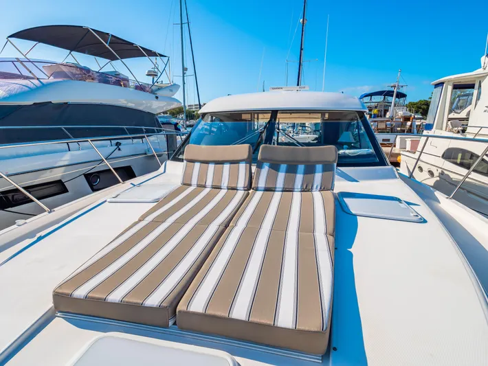 Belle-rosa Yacht Photos Pics 2016 Riviera 5000 Sport Yacht with striped sun loungers.