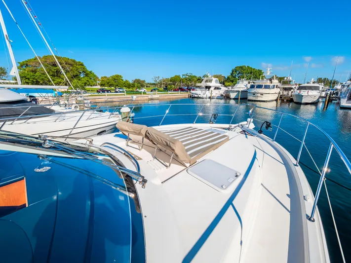 Belle-rosa Yacht Photos Pics Riviera 5000 Sport Yacht 2016 docked in sunny marina.