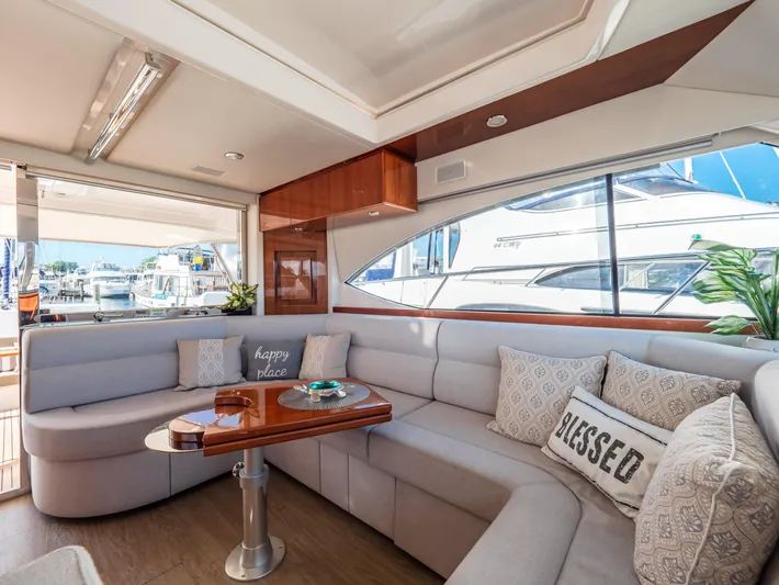 Belle-rosa Yacht Photos Pics Interior of 2016 Riviera 5000 Sport Yacht with luxurious sofa and cushions.