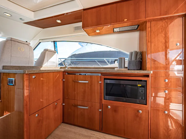 Belle-rosa Yacht Photos Pics Interior of 2016 Riviera 5000 Sport Yacht featuring modern kitchen.