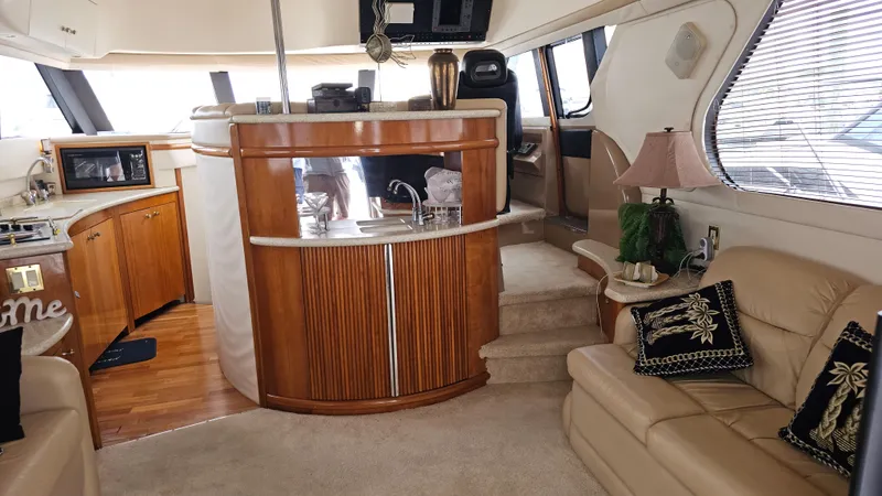  Yacht Photos Pics Luxurious interior of 2000 Carver 450 Voyager Pilothouse yacht with elegant furnishings.