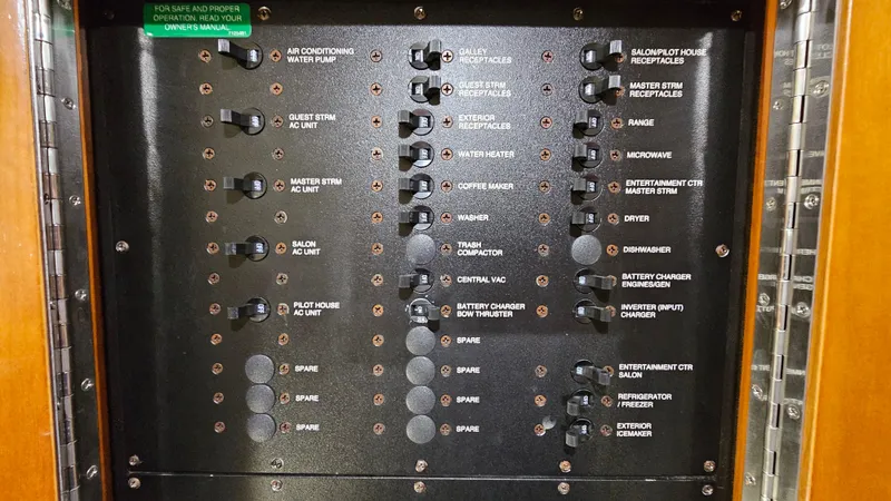  Yacht Photos Pics Electrical panel of 2000 Carver 450 Voyager Pilothouse with labeled switches and controls.