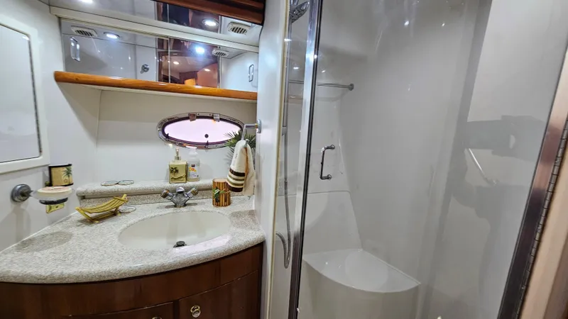  Yacht Photos Pics Luxurious bathroom in 2000 Carver 450 Voyager Pilothouse yacht with modern amenities.