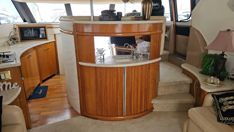  Yacht Photos Pics Interior of 2000 Carver 450 Voyager Pilothouse with wood cabinetry and modern amenities.