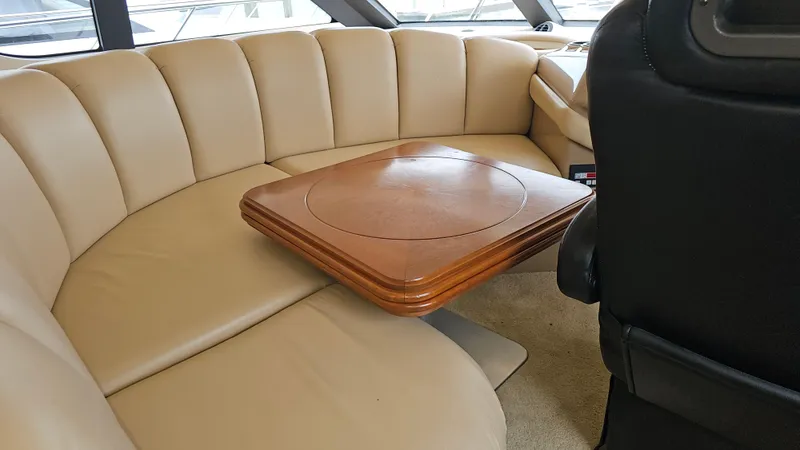  Yacht Photos Pics Luxurious seating area in 2000 Carver 450 Voyager Pilothouse with wooden table.