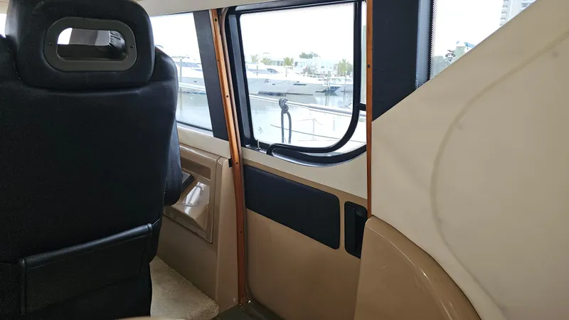  Yacht Photos Pics Interior view of 2000 Carver 450 Voyager Pilothouse, showcasing seating and window details.