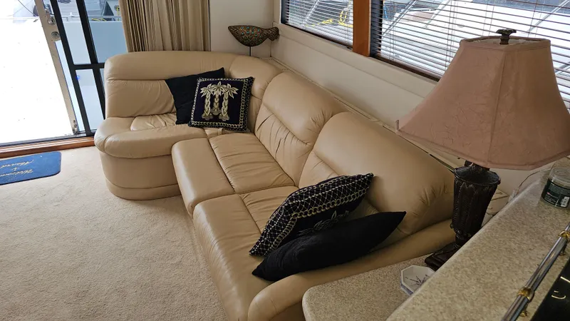  Yacht Photos Pics Luxurious interior of 2000 Carver 450 Voyager Pilothouse with beige leather sofa.