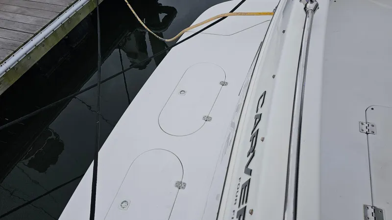  Yacht Photos Pics Carver 450 Voyager Pilothouse 2000 docked, showing deck details and mooring lines.