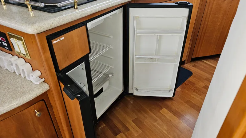  Yacht Photos Pics Open refrigerator in 2000 Carver 450 Voyager Pilothouse yacht kitchen interior.