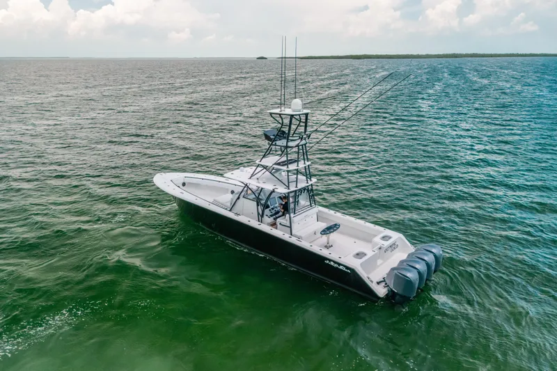  Yacht Photos Pics 2013 SeaHunter 45 boat on open water, featuring multiple outboard engines.