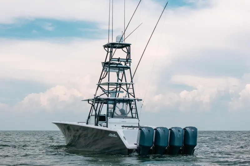  Yacht Photos Pics 2013 SeaHunter 45 boat with four engines on open water under cloudy sky.