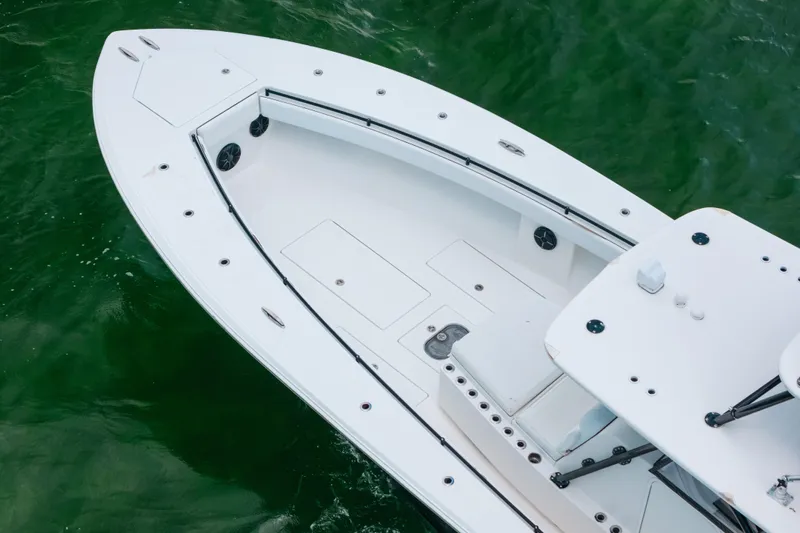  Yacht Photos Pics 2013 SeaHunter 45 boat, aerial view, white deck, on green water.