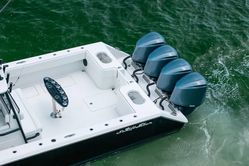  Yacht Photos Pics 2013 SeaHunter 45 boat with four powerful outboard engines on green water.