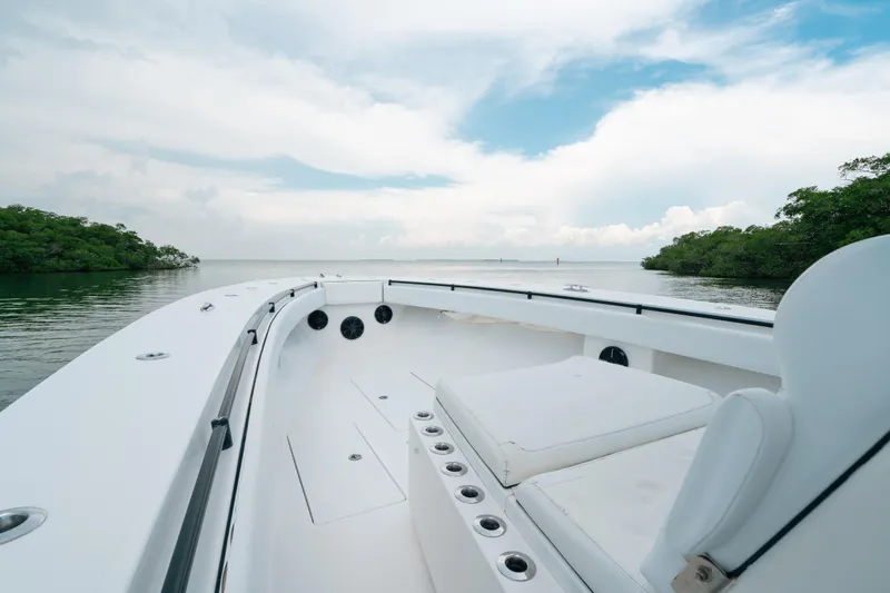  Yacht Photos Pics 2013 SeaHunter 45 boat interior with open water and lush greenery in the background.