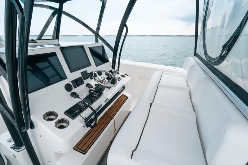  Yacht Photos Pics Helm of 2013 SeaHunter 45 boat with modern navigation equipment and seating.