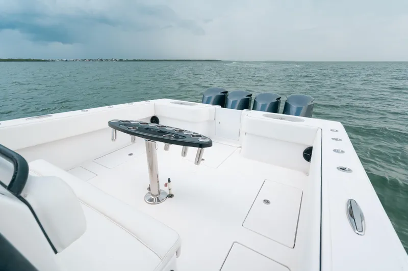  Yacht Photos Pics 2013 SeaHunter 45 boat deck with rod holders, ocean view in background.