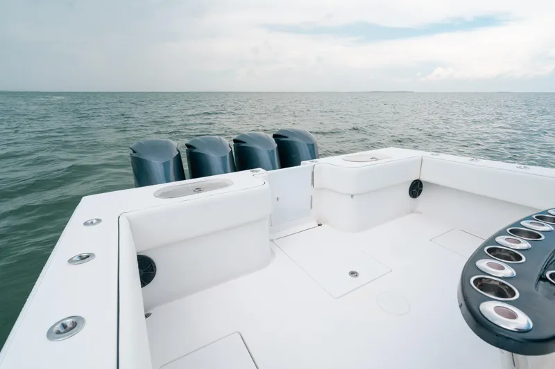  Yacht Photos Pics SeaHunter 45 boat deck with multiple outboard engines, 2013 model, on open water.