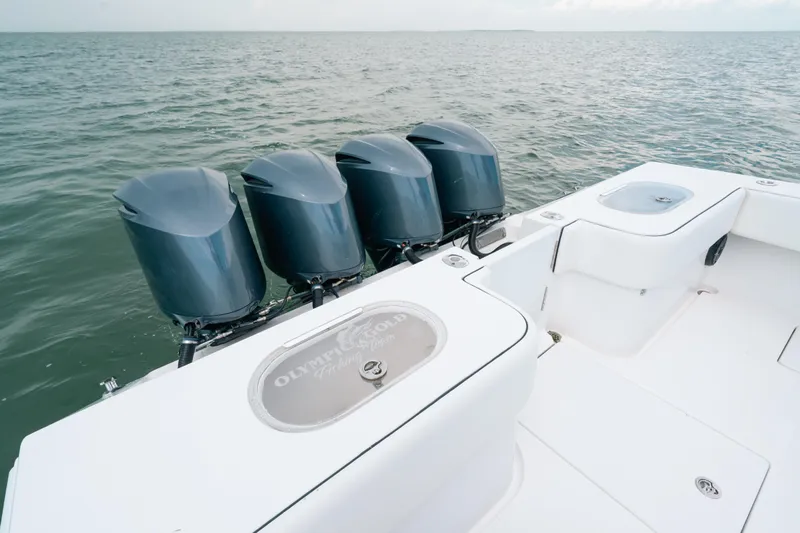  Yacht Photos Pics 2013 SeaHunter 45 boat with four powerful outboard engines on open water.