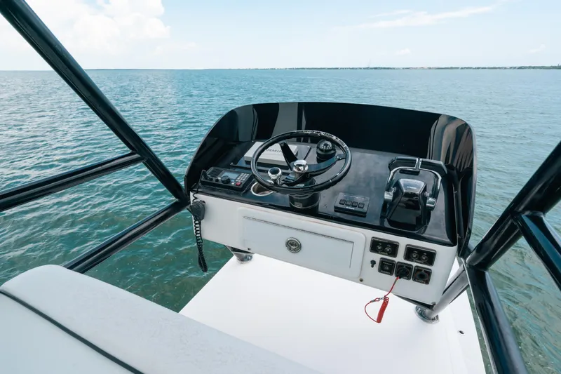  Yacht Photos Pics Helm of 2013 SeaHunter 45 boat with ocean view and navigation controls.