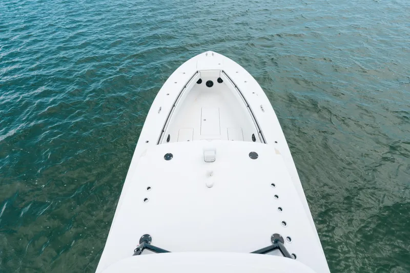  Yacht Photos Pics Bow view of 2013 SeaHunter 45 boat on calm water.