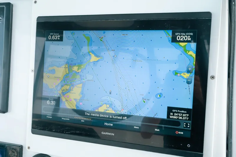  Yacht Photos Pics Garmin navigation display on 2013 SeaHunter 45 boat, showing GPS map and coordinates.