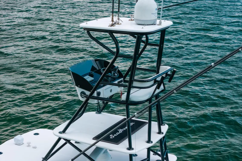  Yacht Photos Pics Tower view of 2013 SeaHunter 45 boat against ocean backdrop.