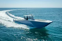 2019 Freeman 42 boat cruising on open ocean waters.