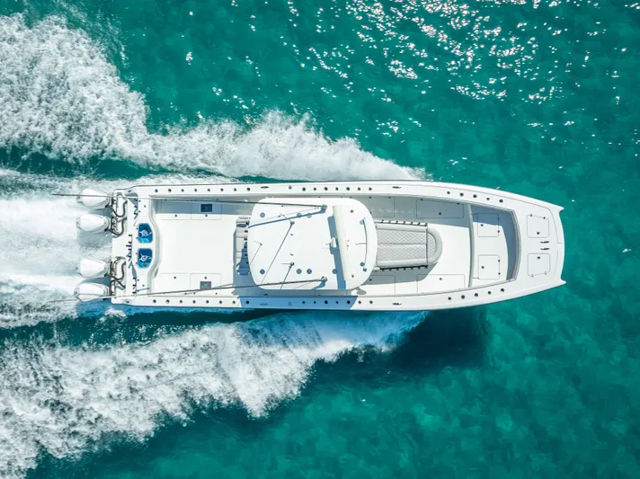  Yacht Photos Pics Aerial view of 2019 Freeman 42 boat cruising on clear turquoise water.