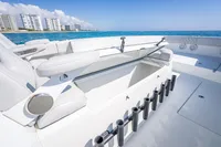 2019 Freeman 42 boat interior with rod holders, ocean view, and city skyline.