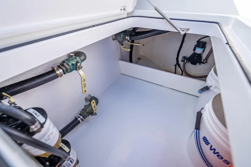  Yacht Photos Pics 2019 Freeman 42 boat storage compartment with hoses and equipment.
