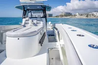 2019 Freeman 42 boat on blue ocean near coastline, featuring sleek design and modern amenities.