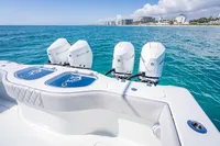 Freeman 42 boat with Mercury engines cruising near a coastal city, 2019 model.