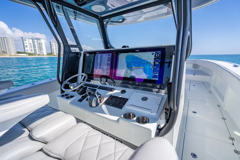  Yacht Photos Pics Interior of a 2019 Freeman 42 boat with modern navigation system and ocean view.