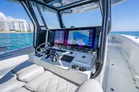 Interior of a 2019 Freeman 42 boat with modern navigation system and ocean view.