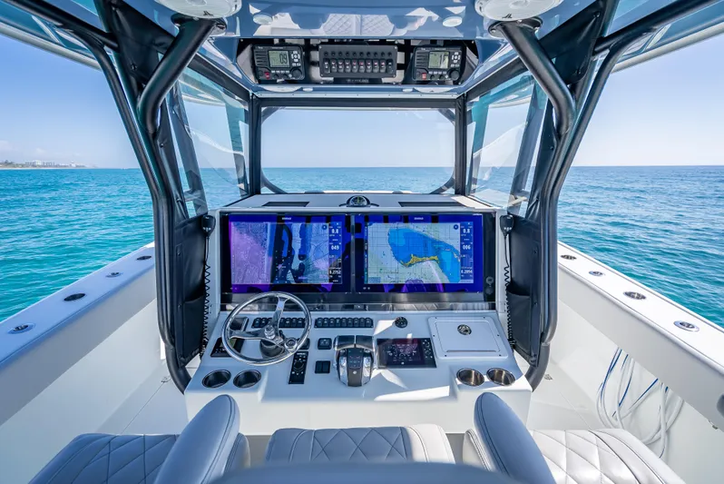  Yacht Photos Pics Freeman 42 boat cockpit with advanced navigation system, 2019 model, on open sea.