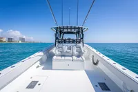 2019 Freeman 42 boat on open water, clear sky, coastal buildings in background.