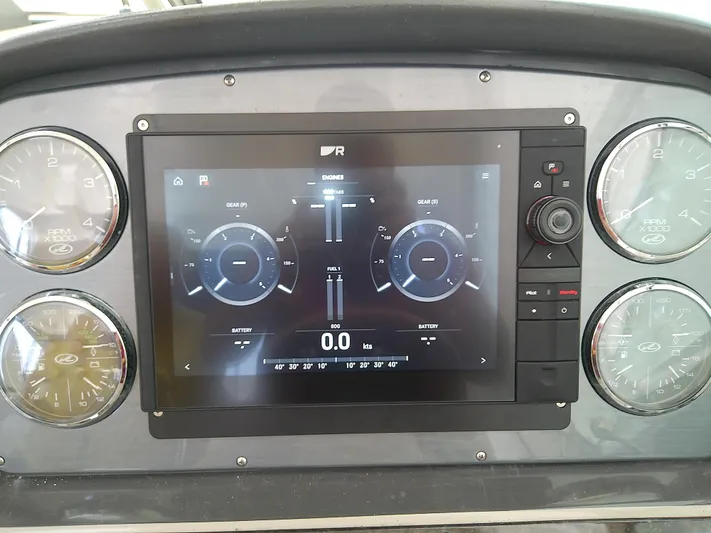 Parrotdise Yacht Photos Pics Dashboard of a 2005 Sea Ray 390 Sundancer with digital and analog gauges.