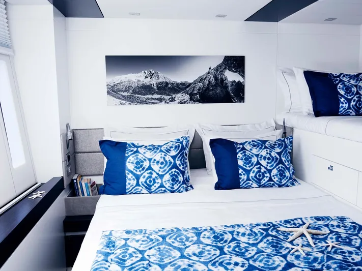 Blue Deer Yacht Photos Pics Luxurious Sunreef 74 yacht bedroom with blue accents and mountain artwork, 2015 model.