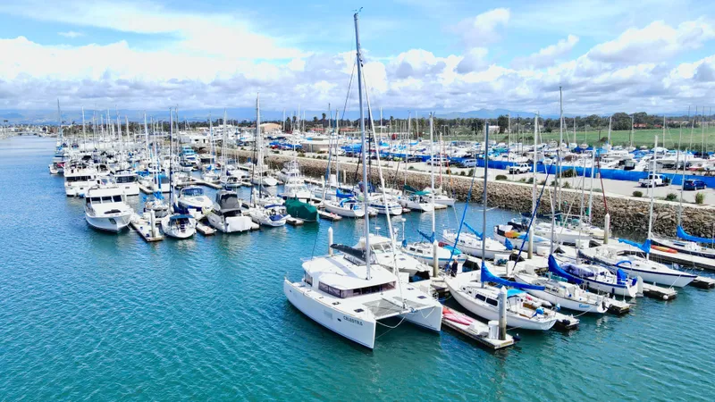 Celestra Yacht Photos Pics Marina with various boats, featuring a 2017 Lagoon 400 S2 catamaran docked.