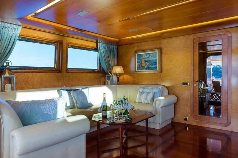  Yacht Photos Pics Luxurious yacht interior with elegant seating, wooden accents, and scenic windows, Cantieri Navali Nicolini 43, 1995.