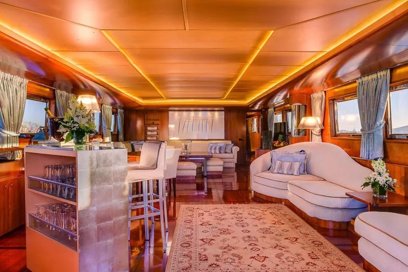  Yacht Photos Pics Luxurious interior of 1995 Cantieri Navali Nicolini 43 yacht with elegant seating and ambient lighting.