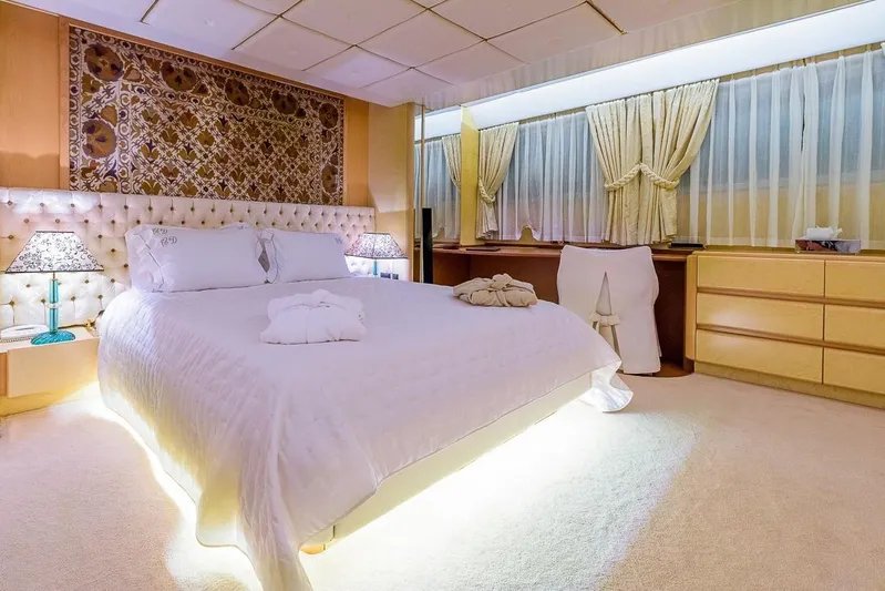  Yacht Photos Pics Luxurious bedroom on Cantieri Navali Nicolini 43 yacht, 1995 model, with elegant decor and ambient lighting.