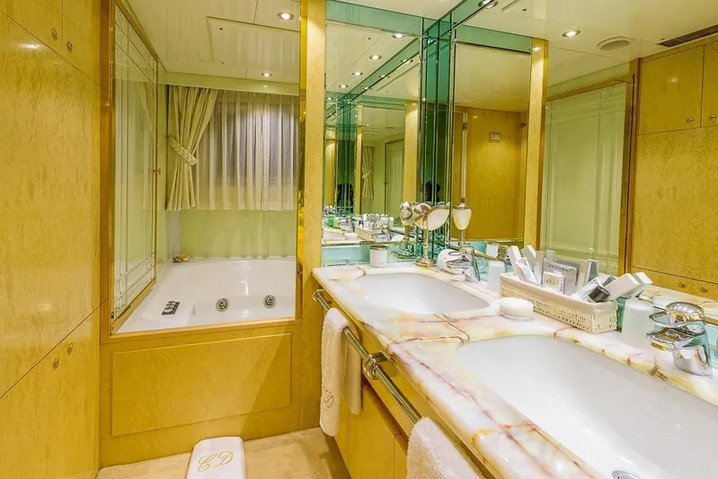  Yacht Photos Pics Luxurious yacht bathroom with dual sinks, marble countertop, and jacuzzi tub, Cantieri Navali Nicolini 43, 1995.